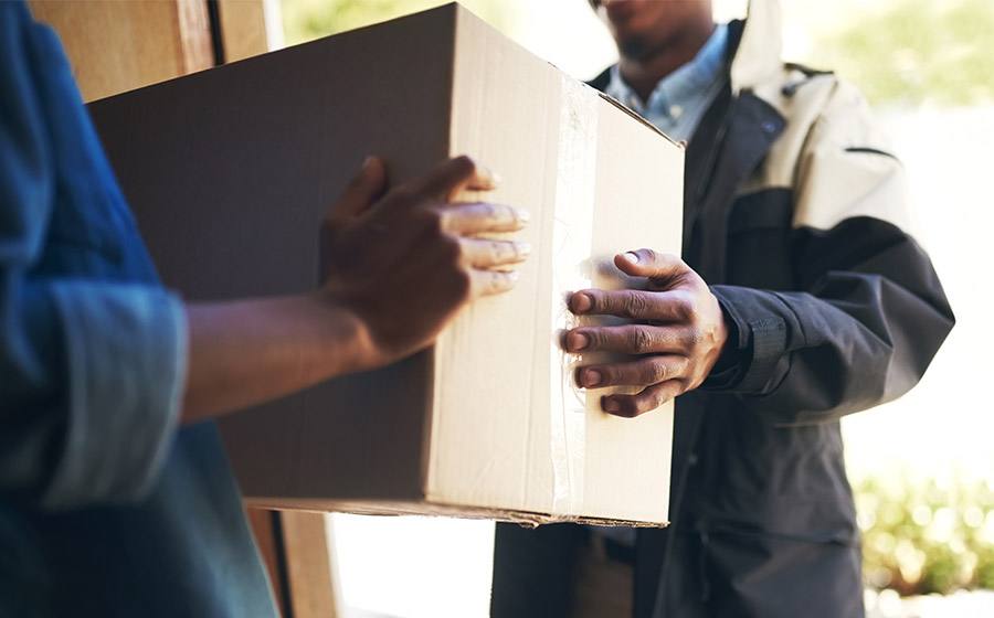 Delivery van dropping off parcels in Zambia